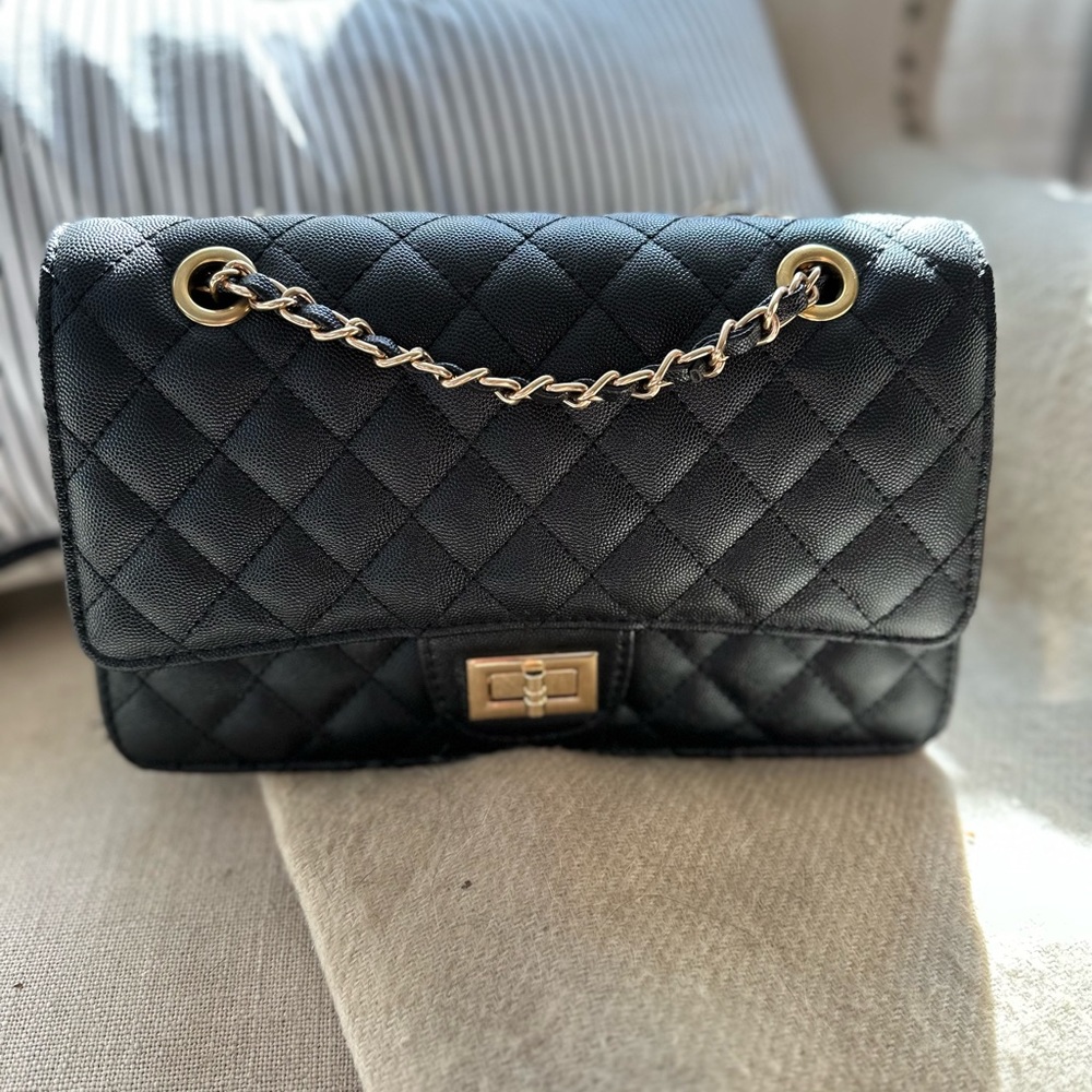 Like NEW, never worn. Look-a-like bag.